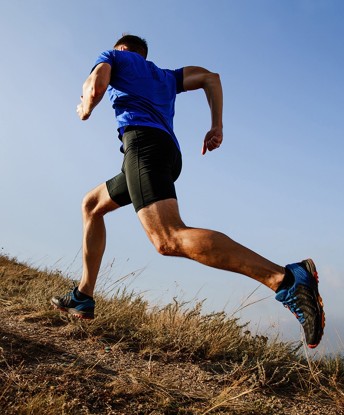 Runner on a trail during daylight hours.