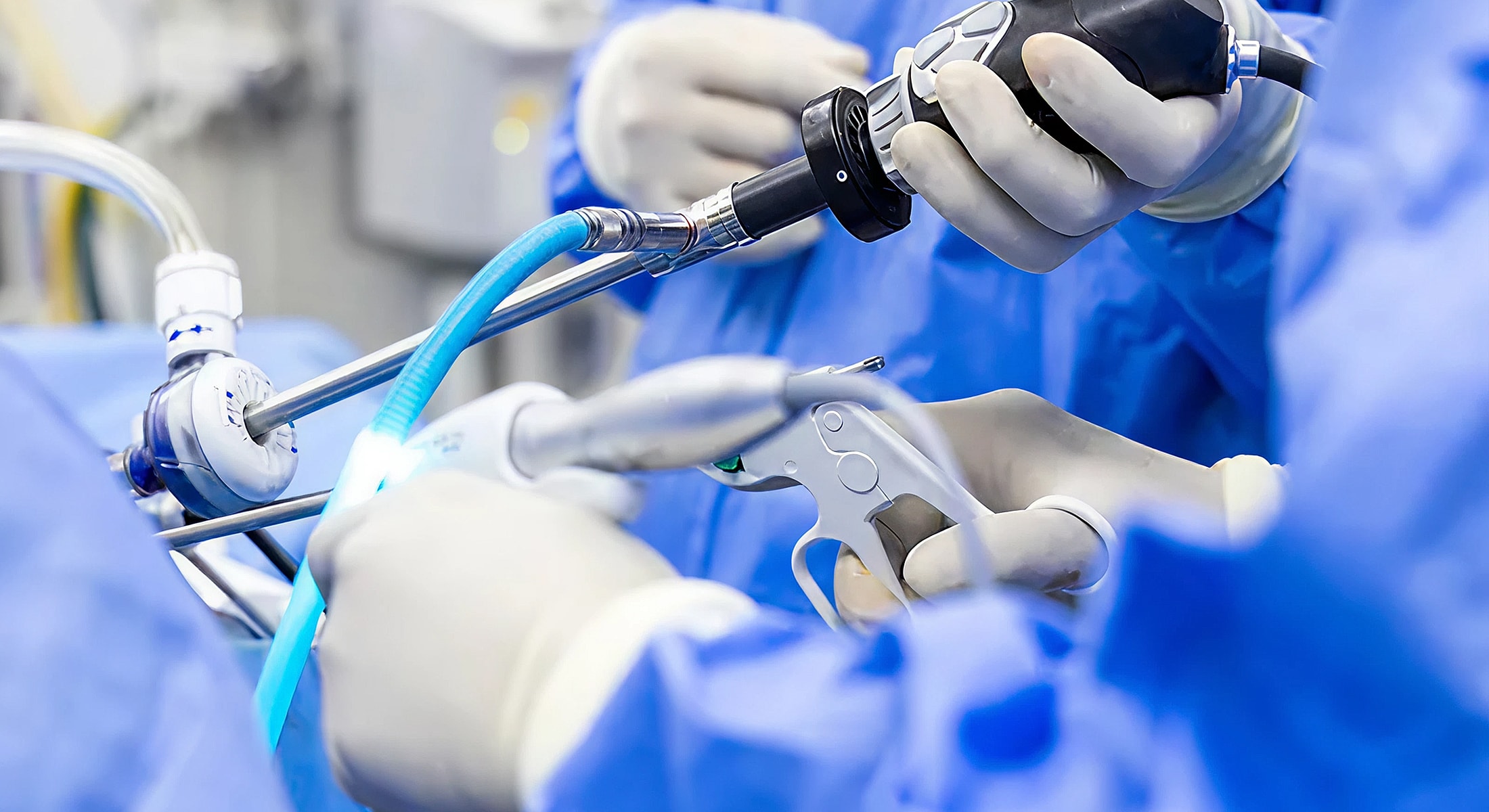 Surgical team using specialized medical instruments.